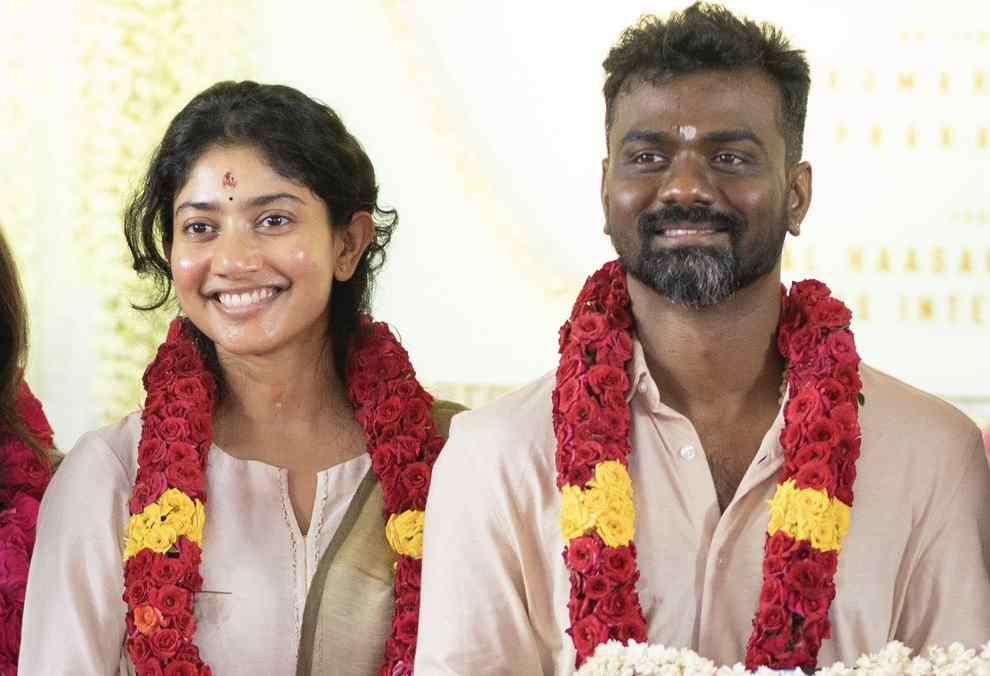 Sai Pallavi and Rajkumar Periyasamy captured in garlands