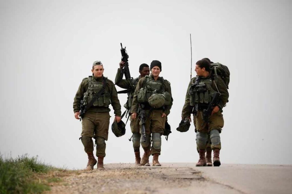 Israeli soldiers patrol the area near the border between Israel and the Gaza Strip, southern Israel