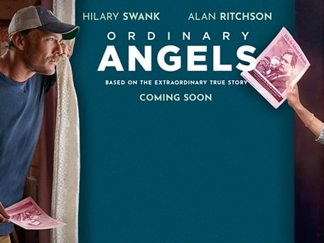 Film poster for "Ordinary Angels" featuring Hilary Swank and Alan Ritchson standing together, smiling.