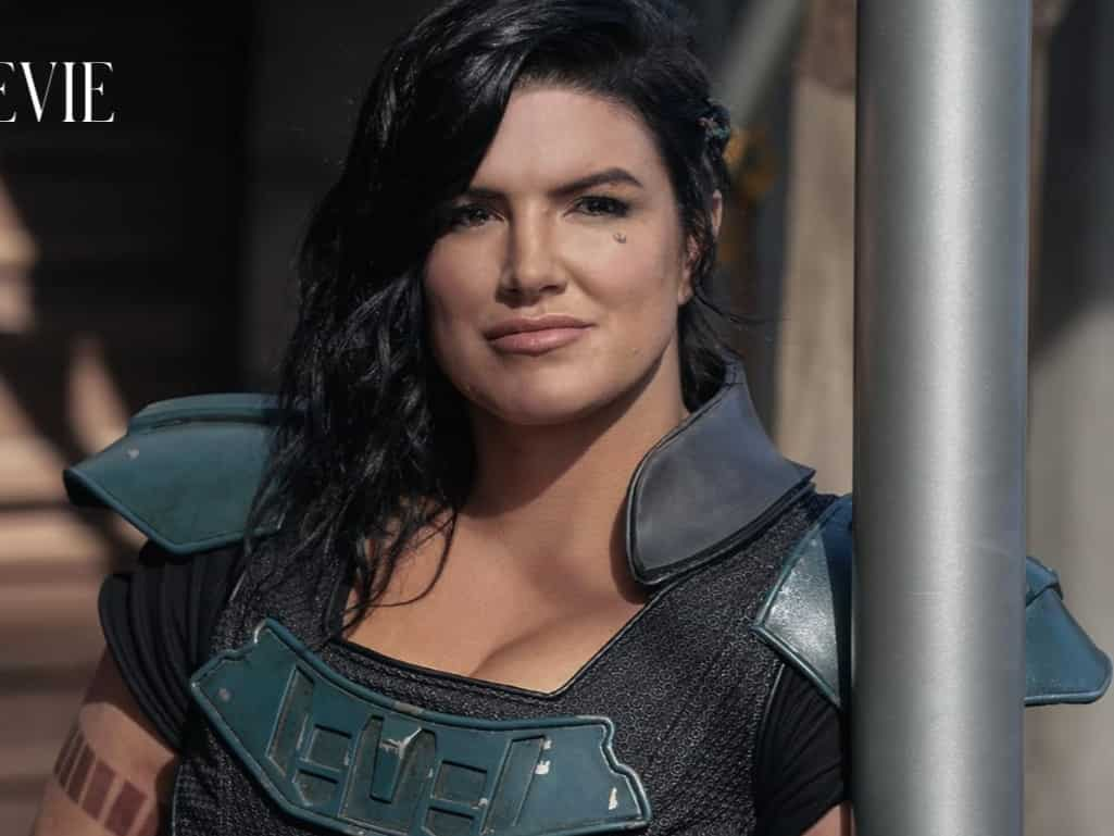 Gina Carano in a determined pose, facing adversity.