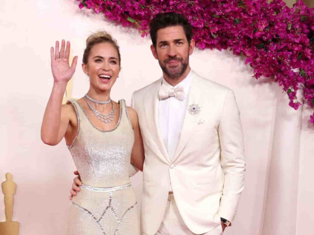 Emily Blunt and John Krasinski walking the Oscars red carpet in coordinated white ensembles