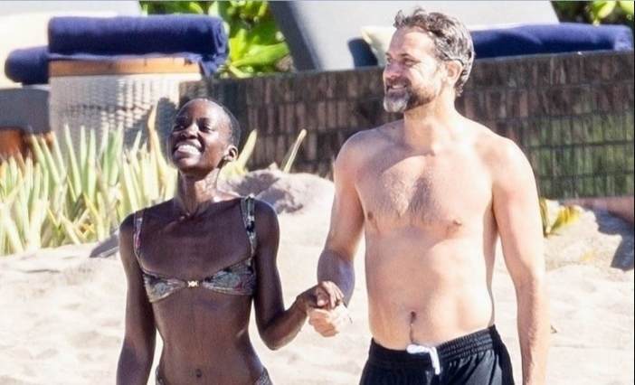 Joshua Jackson and Lupita Nyong'o hand in hand