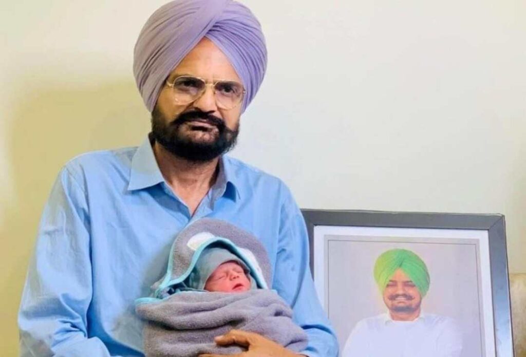 Balkaur Singh Sidhu with his new born baby and aside Sidhu Moosewala's photo