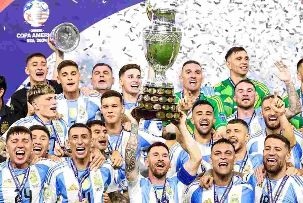 Lionel Messi holding the Copa America 2024 Trophy with his team